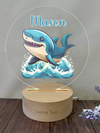 a wooden stand with a picture of a shark on it