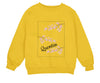 a yellow sweatshirt with a picture of a cherry blossom tree